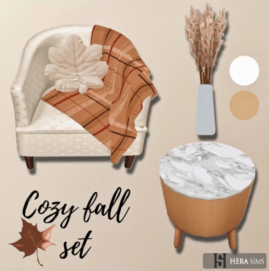 Cozy fall decor set with a plush armchair, plaid throw blanket, decorative vase with dried pampas grass, and marble top accent table for warm autumn interior design.