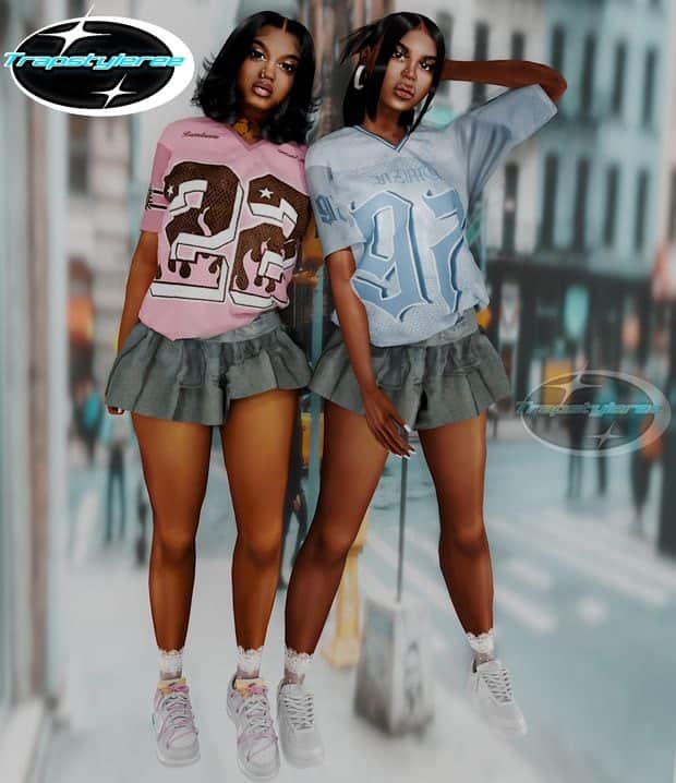 Fashion-forward young women in colorful graphic sports jerseys and ruffled gray skirts on a city street. Trendy streetwear, casual style, urban fashion, youthful outfits, Must Have Mods clothing.