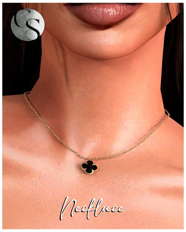 Gold chain necklace with black four-leaf clover pendant, stylish jewelry accessory for women.